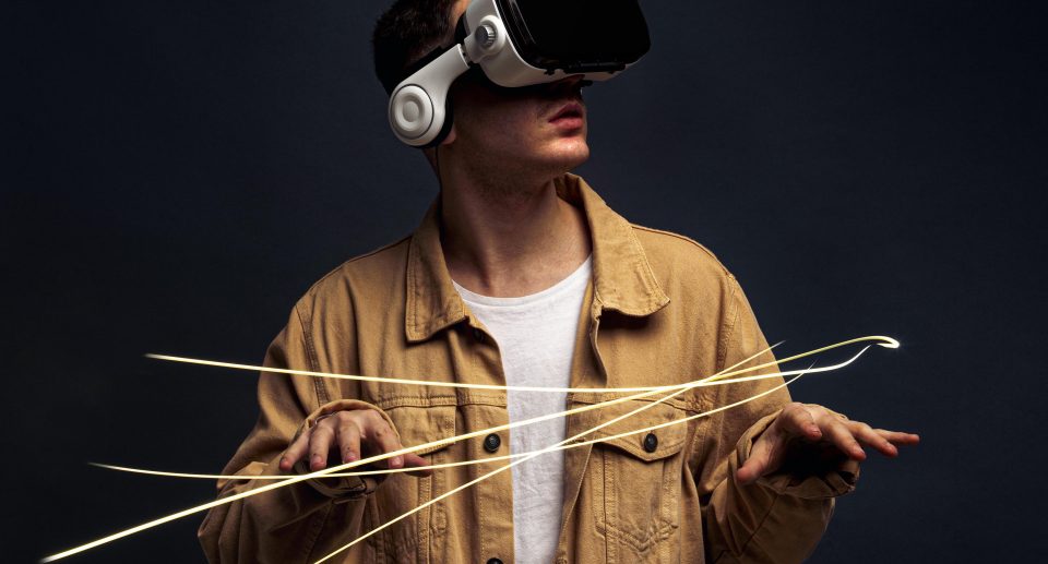 young-man-wearing-virtual-reality-goggles-with-special-effects